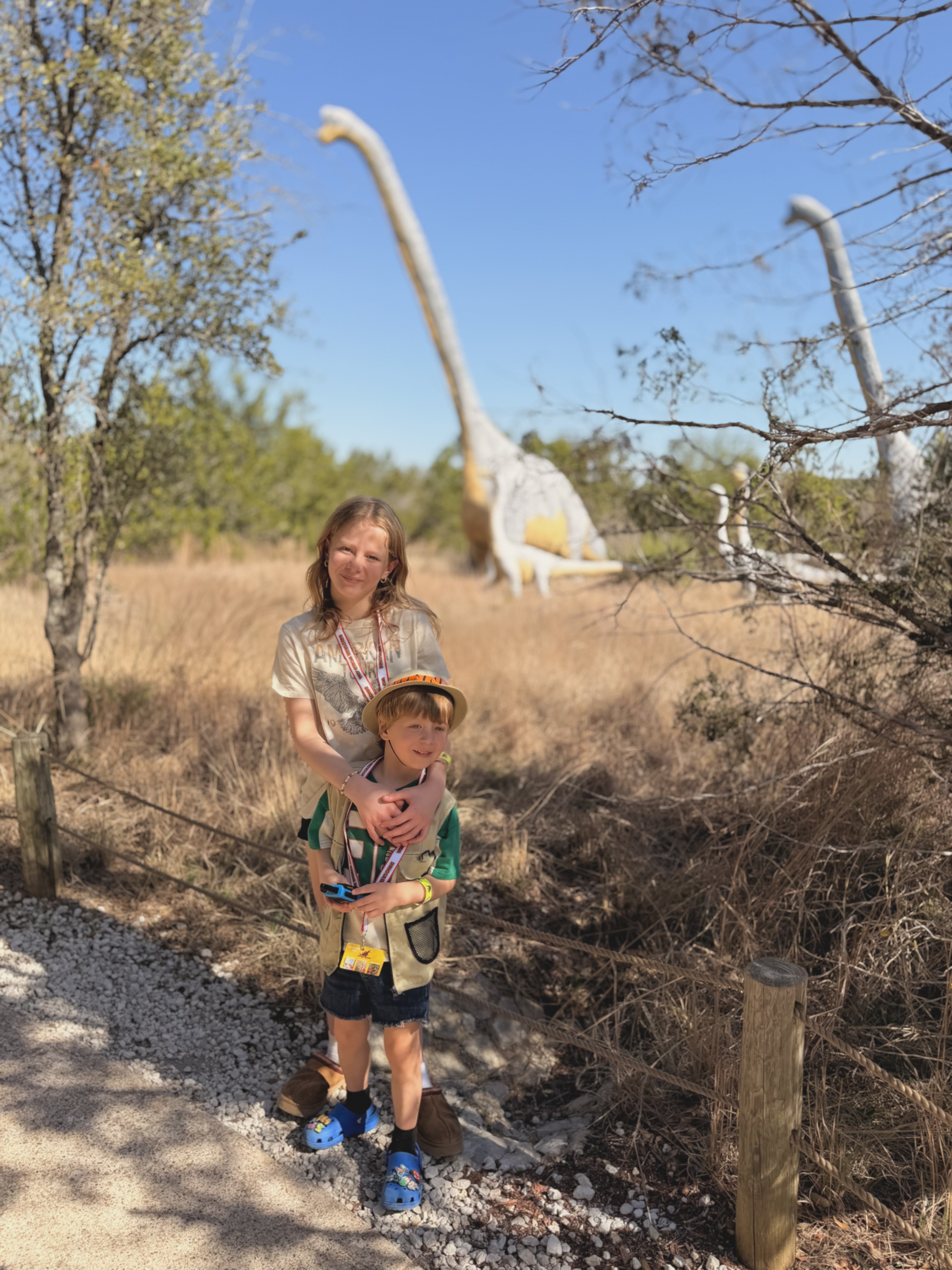 Ruby and Gus on the path with Brontosaurus